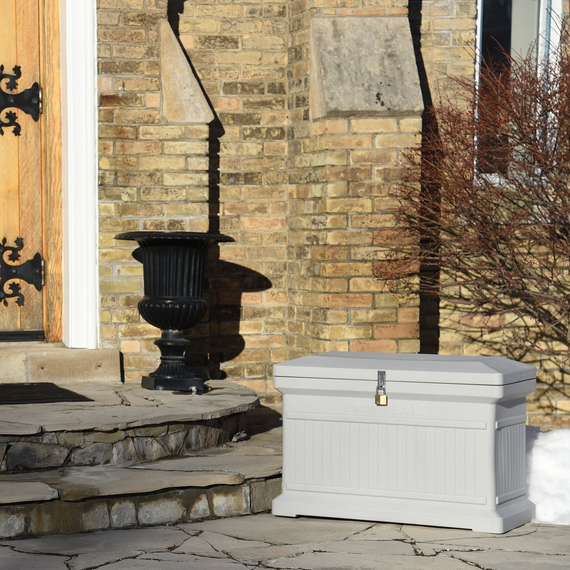 Slate grey ParcelWirx horizontal premium dropbox with lock on front porch