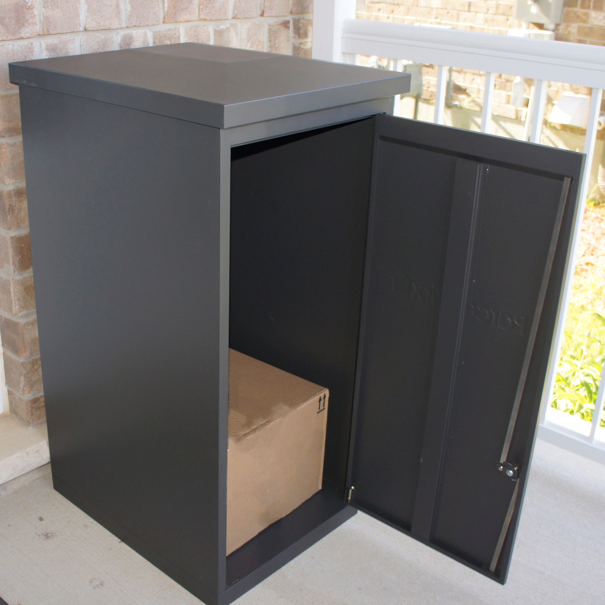 ParcelWirx storage cabinet open with box inside on a front porch