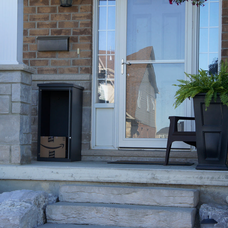 close up of ParcelWirx storage cabinet with door open and a box inside on a front porch