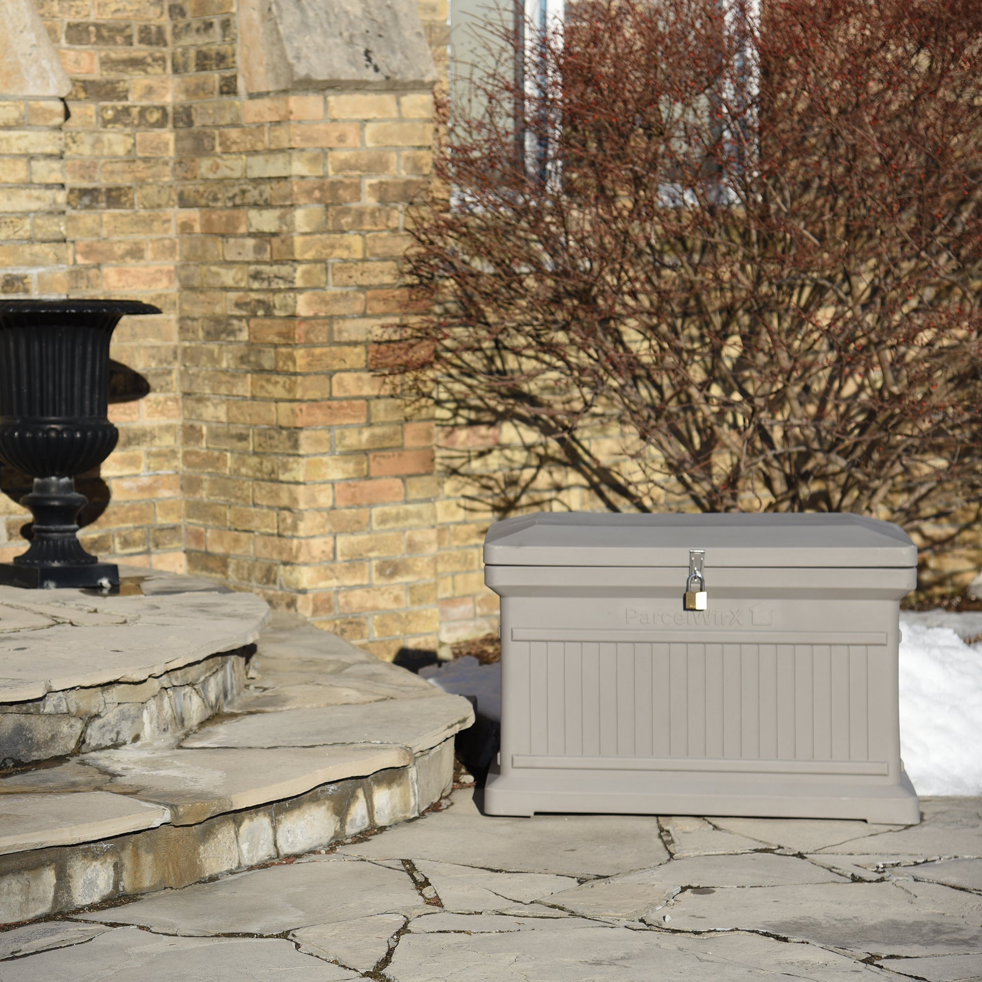 Pewter ParcelWirx horizontal premium dropbox with lock on front porch