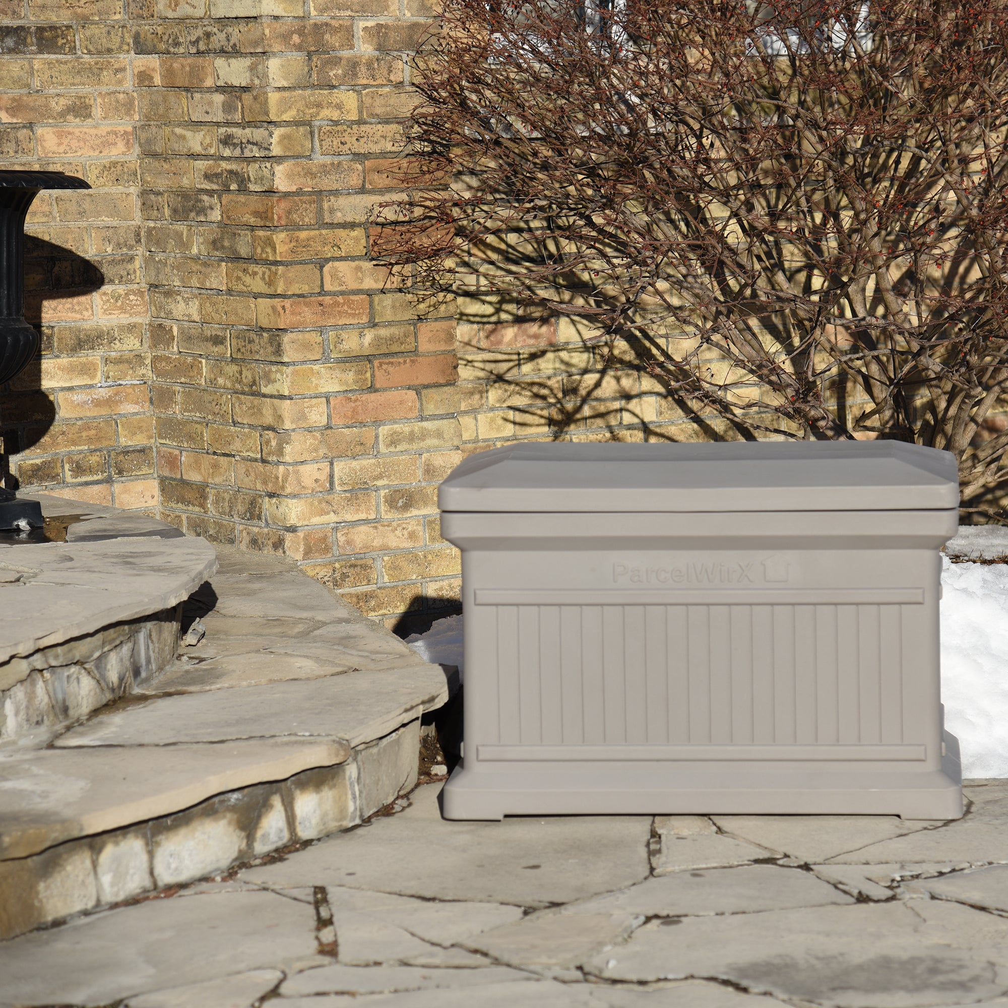 Prestige Pewter ParcelWirx horizontal standard from the front with the lid on, on a front porch
