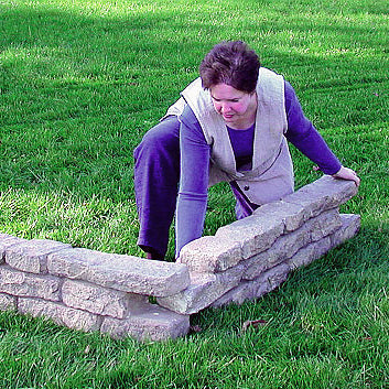 women putting together two straight pieces of rock lock on a grass lawn