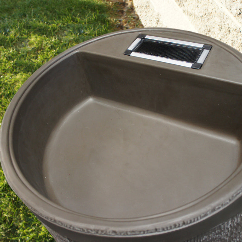 Close up of planter and screen on round rain barrel