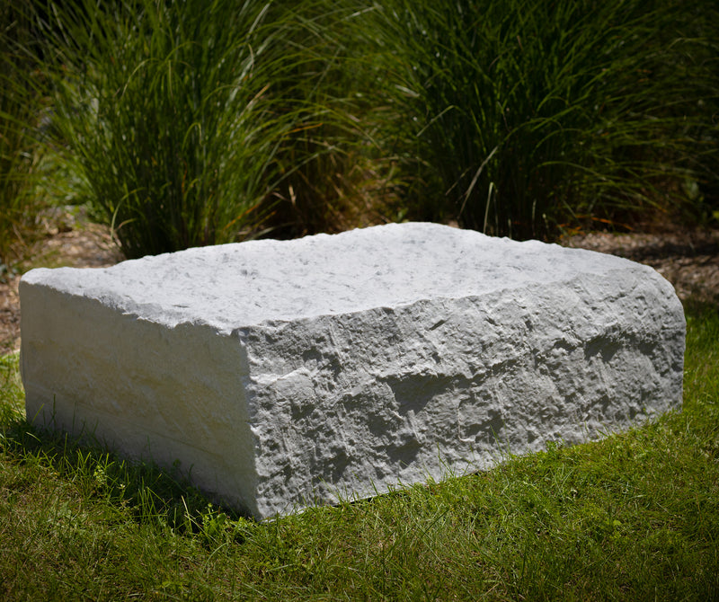 extra large landscape rock on grass